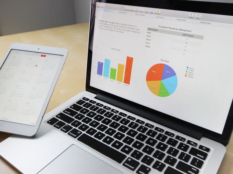 Laptop screen displaying analytics graphs and traffic metrics dashboard